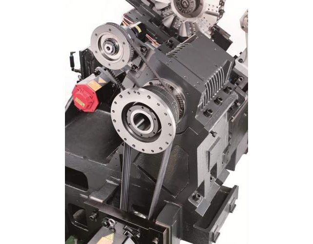 Black mechanical device with red knob, silver gear, and metal shaft on gray background.