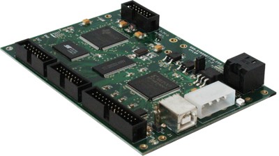 Green circuit board with microprocessor, memory chips, and USB ports on a light gray background.