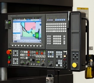Industrial machine touchscreen control panel with grid buttons and graphical interface.