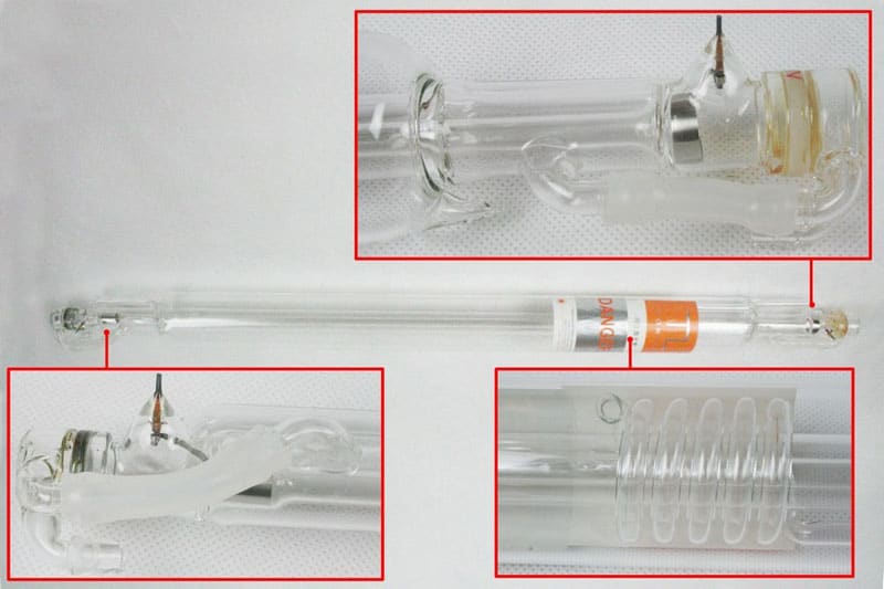 Glass laser tubes with highlighted components on a white background.