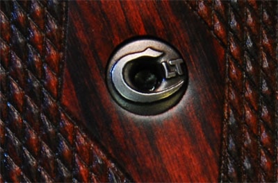 Close-up of an engraved bolt on a firearm.