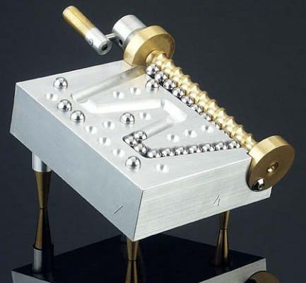 Ball screw with intricate metal construction.