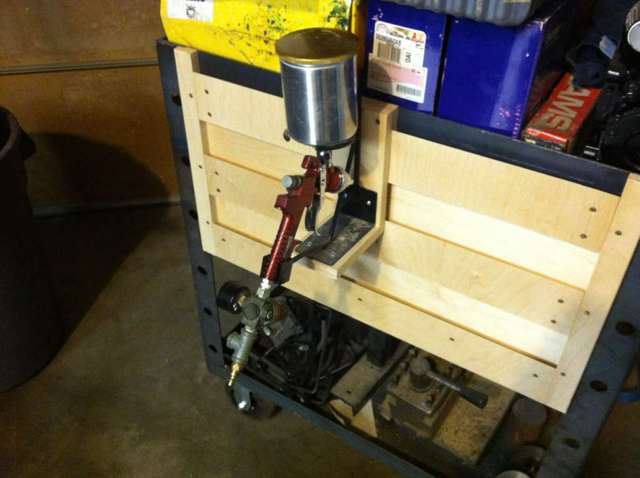 Spray gun attached to a French cleat bracket.