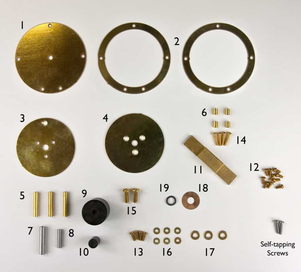 Brass and metal parts, including washers and screws, arranged in a grid pattern on a white background.