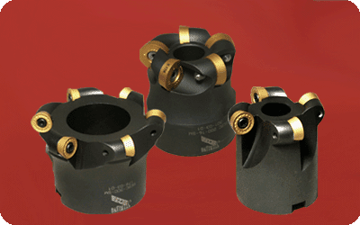 Black plastic tool with gold accents and three circular holes.