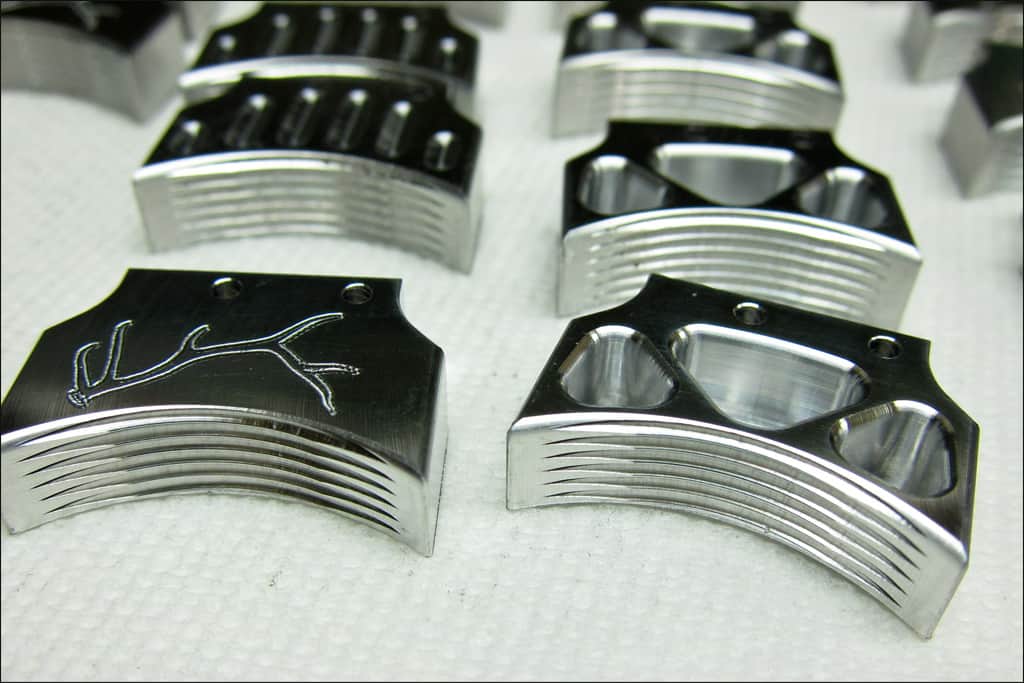 Silver metal parts with intricate designs.