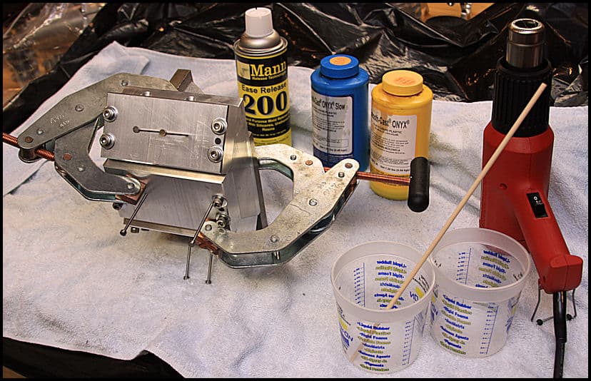 Machining tools and metal fabrication equipment on a table.