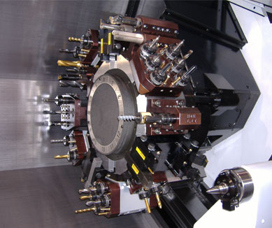 Gang turret hybrid milling machine with turret and spindle.