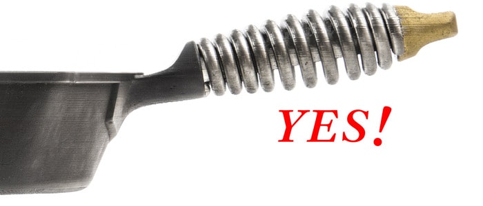 Threaded metal handle on a skillet.