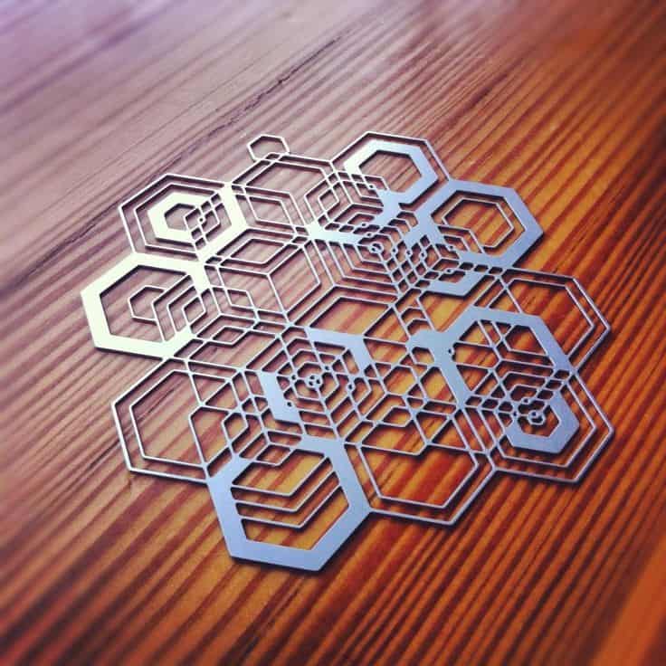 Laser-cut hexagonal shapes with intricate designs.