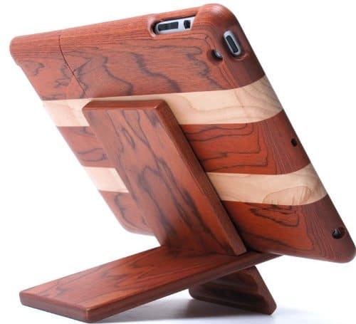 A wooden stand holding an iPad with a visible natural wood grain pattern.