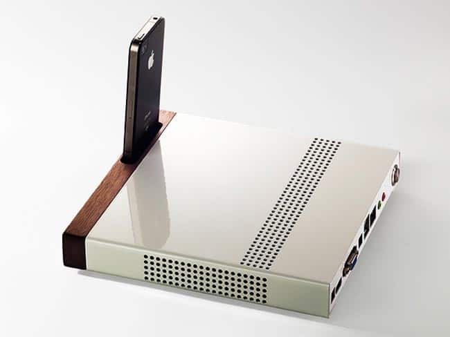 Sleek white device with a small iPhone on it.