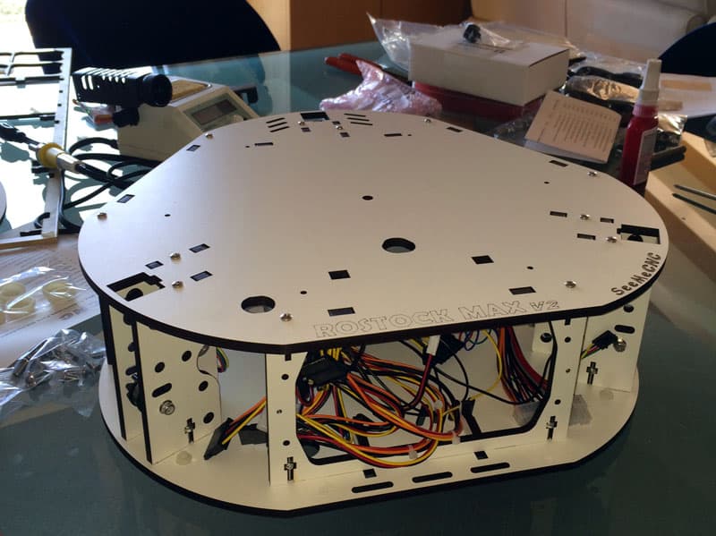 Rostock Max V2 3D printer base plate with tools and materials.