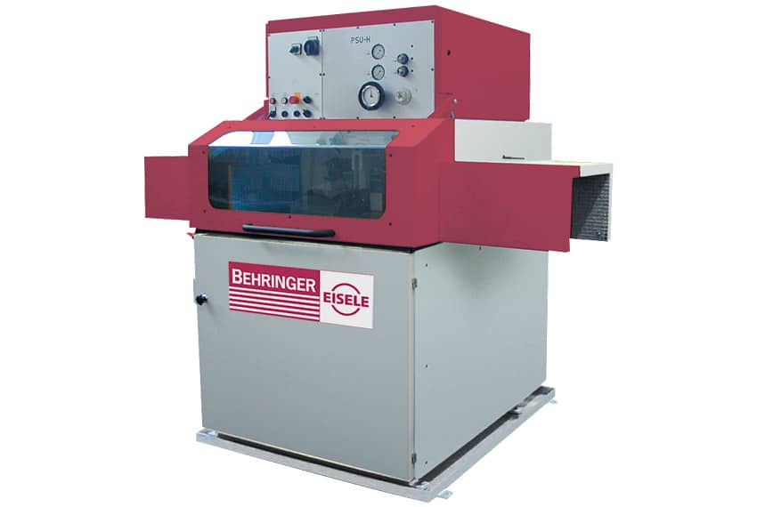 Red and gray industrial machine with control panel, glass window, and Behringer Eisele logo.