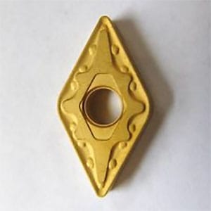 Yellow diamond-shaped metal cutting tool with central hole and small protrusions.