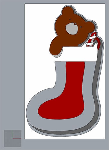 A festive Christmas stocking with a teddy bear peeking out, on a gray background.