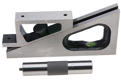 Silver caliper with black handle and small metal cylinder.