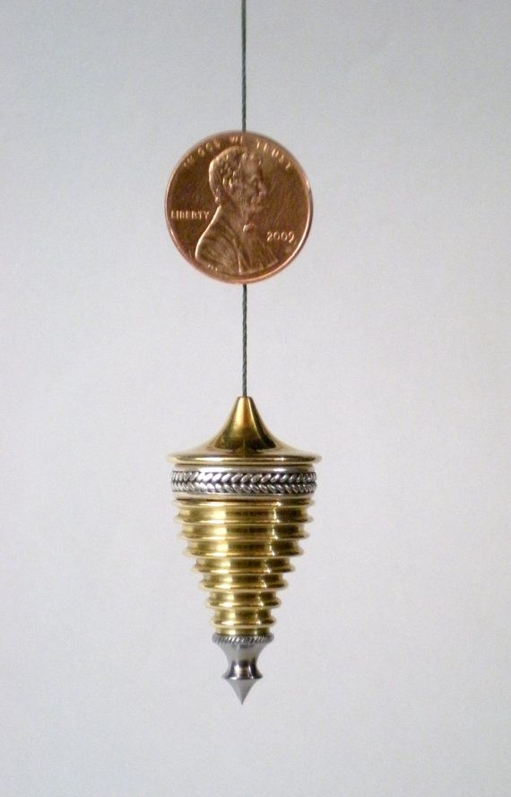 Brass and silver plumb bob with American penny.