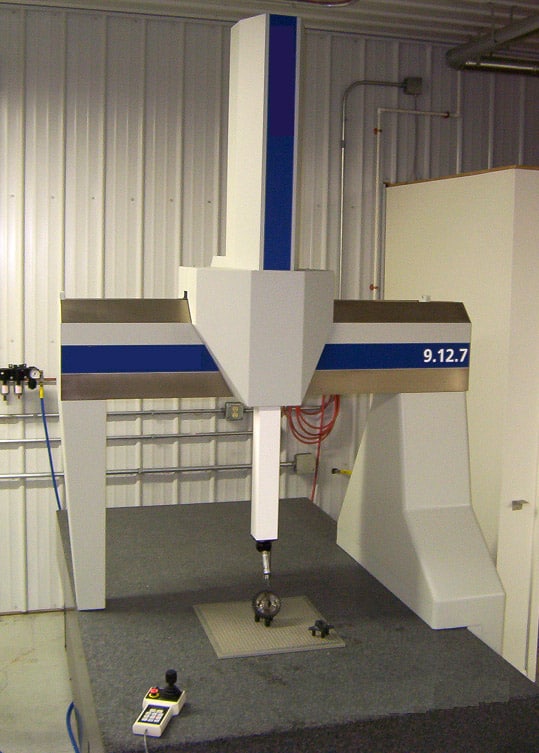 A white Coordinate Measuring Machine (CMM) with blue stripes and silver accents in a well-lit room, featuring an open arm with probe attached.