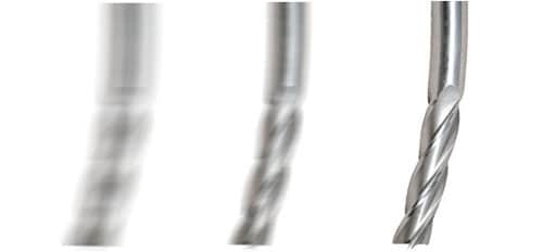 Twisted end mill with blurred background.