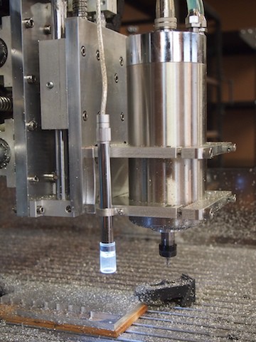 Metal tool with cylindrical body and small nozzle.