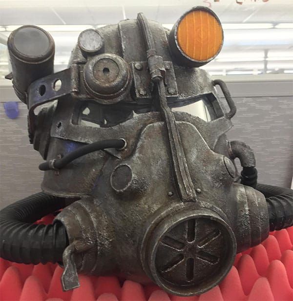 Replica T-51b power armor helmet from the Fallout video game series, with weathered metal finish and details.