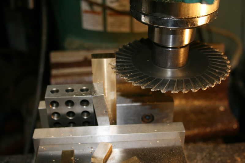 Machine shop equipment with gears, levers, and mechanical parts.