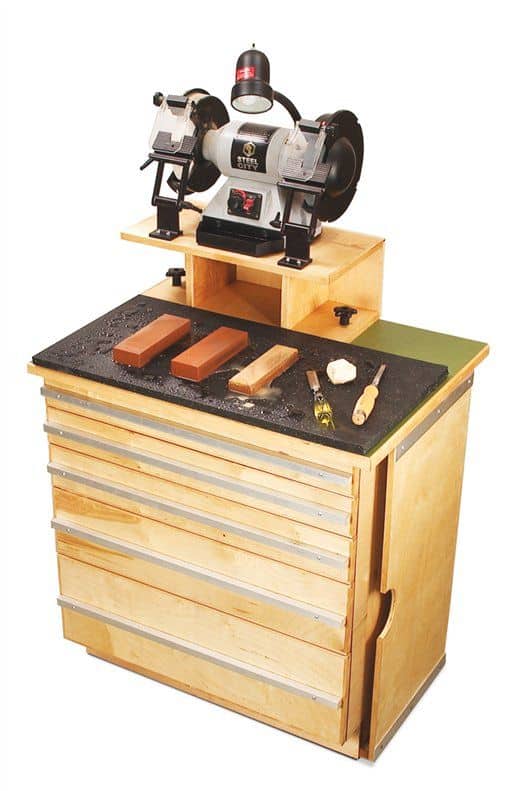 Compact polishing stand with built-in vice and drawers.