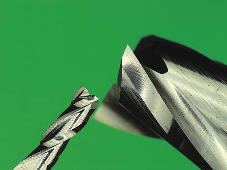 A micro-mill end mill cutting tool on a green background.