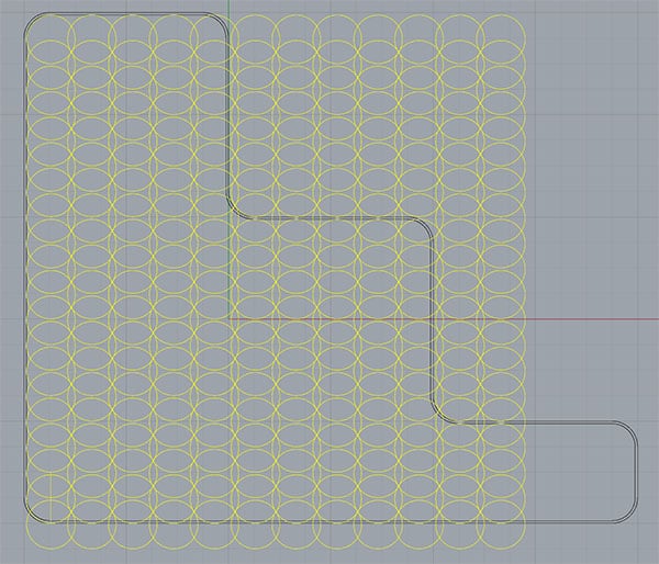Yellow CAD design with interconnected circles on a gray background, featuring a router bit.