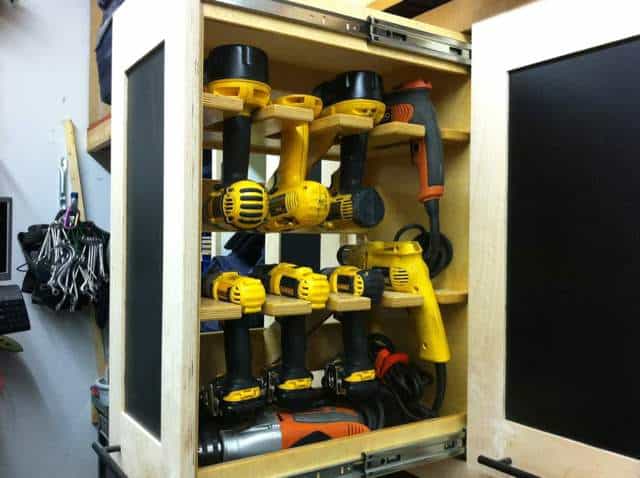 Compact tool cabinet with adjustable shelves and black glass doors.