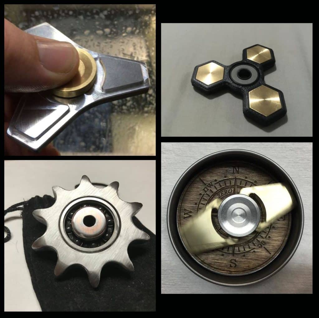 Four distinct fidget spinners with various metallic and plastic designs.