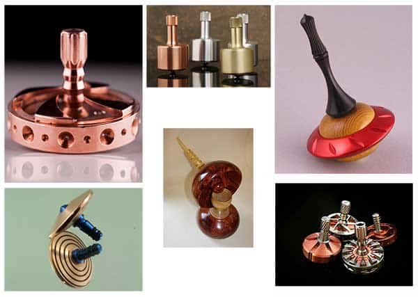 Hand-crafted top spin toys made from wood, metal, and plastic.