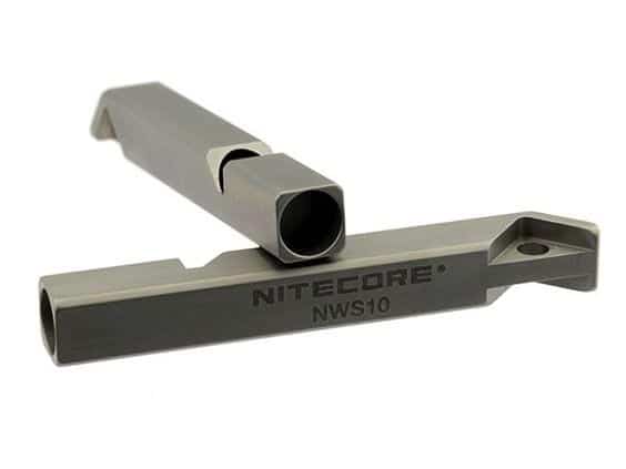 Close-up of NITECORE branded titanium metallic whistle.