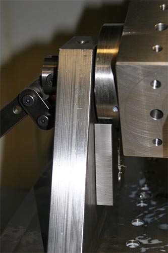 Metal machining tool with ridges and grooves on its metal surface.