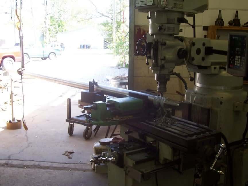 Industrial-sized milling machine in a metal fabrication workshop.