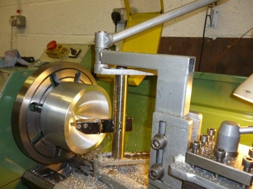 A ball turning or grinding machine setup in a workshop or factory setting.