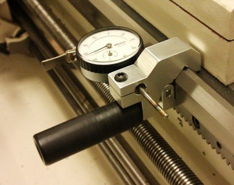 Dial indicator used for precise part measurement.