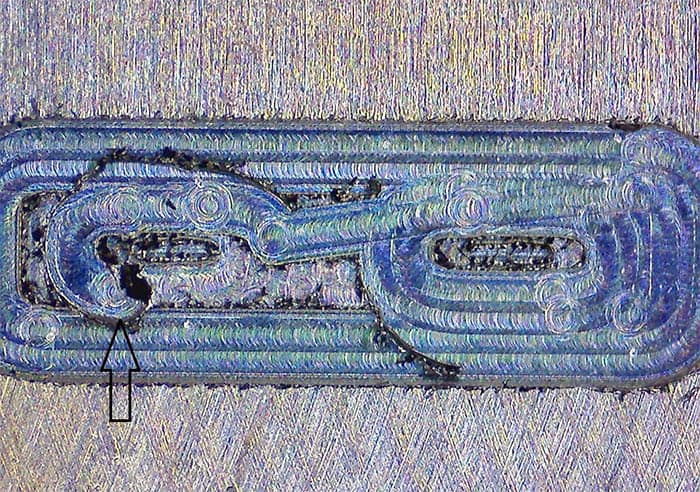 Metal surface with wear marks from a cutting tool.