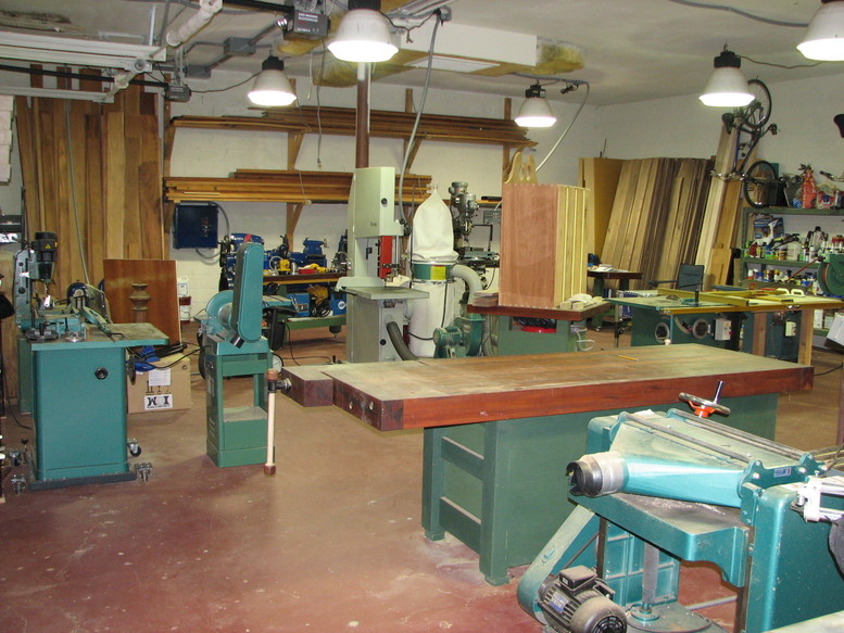 Well-equipped woodworking shop with various tools and equipment.
