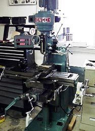 Large vertical milling machine with BEAR MILL sign and digital control panel.