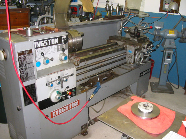 Gray Kingston lathe with "KINGSTON" panel and metal cylinder.