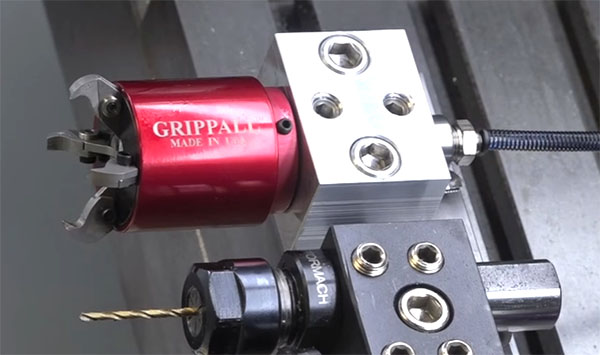 Red Grippa Bar Puller on industrial metal plate with USA logo.