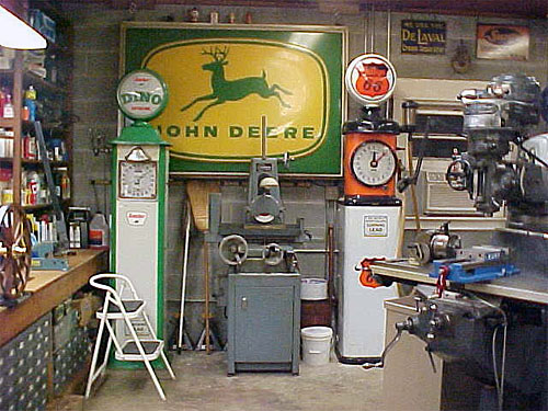 Cluttered workshop with various tools and equipment.