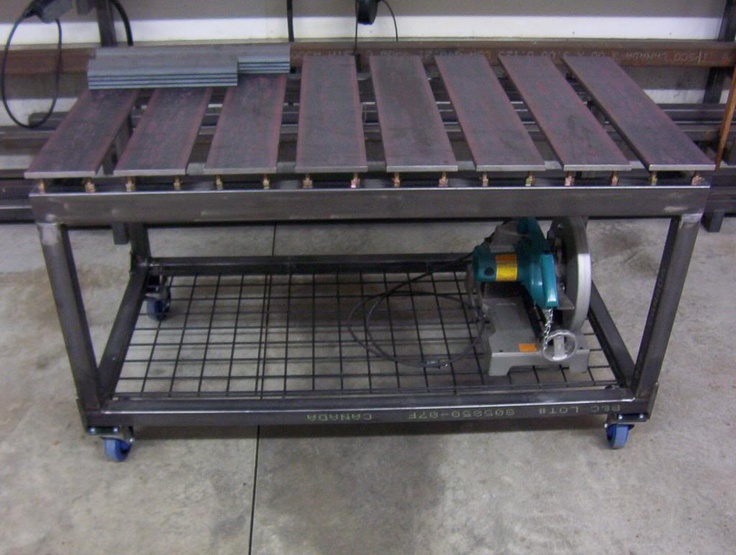 Sturdy metal clamping table with grid-patterned bottom shelf and wooden slats on top.