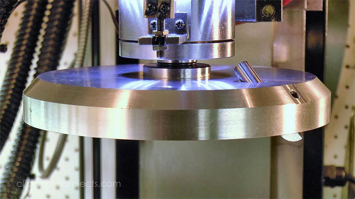 A large diameter fly cutter with spring loaded center and cylindrical body.