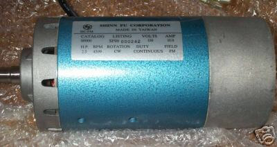 A blue cylindrical DC motor with a white brushless motor label.