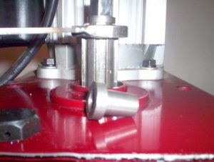 Red metal part with silver drawbar spacer.