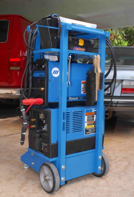 A blue welding cart with a Dynasty 200 welder.