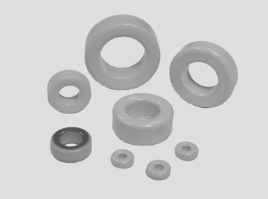 Ferrite beads in various sizes, each with a central hole.